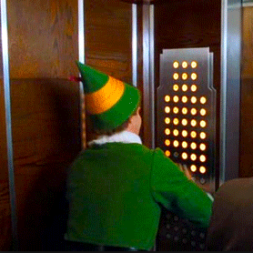Will Ferrels character buddy from the movie elf pressing all of the elevator buttons